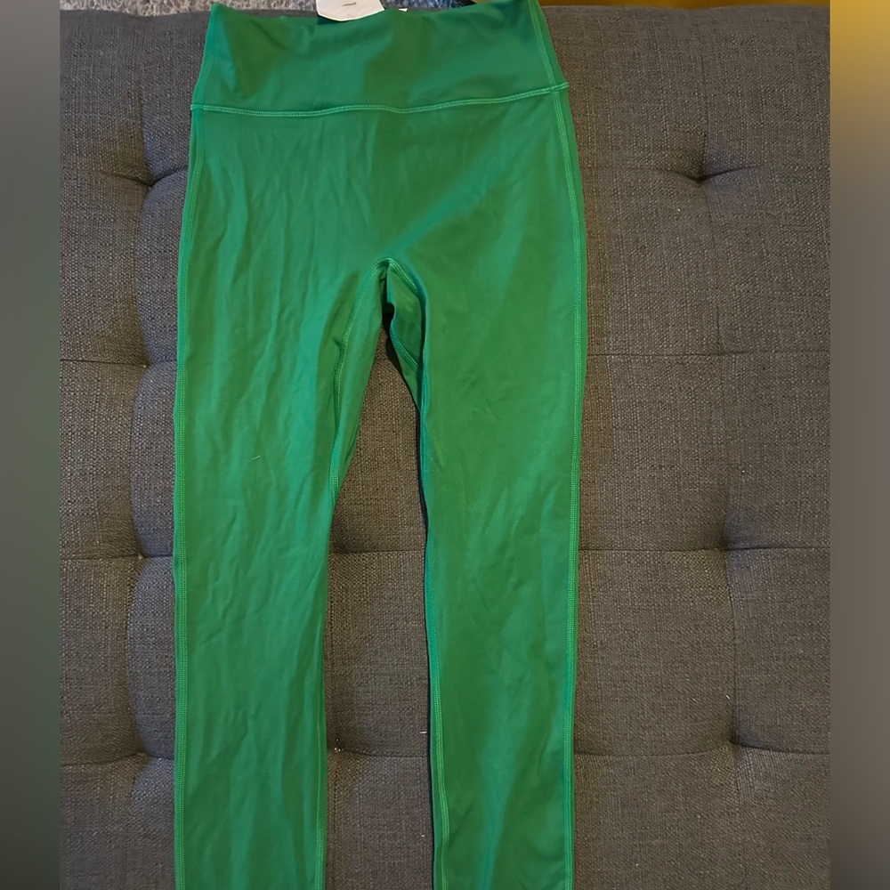 NWT Fabletics super fun green leggings/  white cross stitch design on back sz.S
